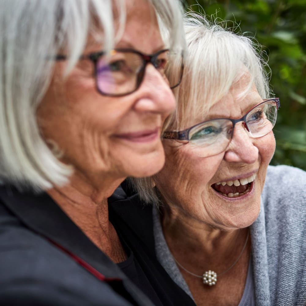 Two smiling residents at Alder Bay Assisted Living in Eureka, California