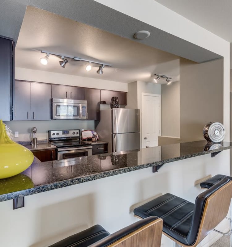 Spacious kitchen with a breakfast bar in a model home at Vue Issaquah in Issaquah, Washington