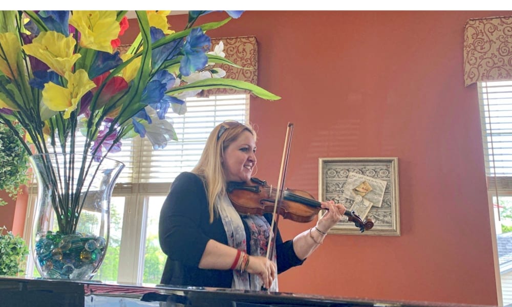 A violinist playing for residents at The Birches of Lehigh Valley in Easton, Pennsylvania