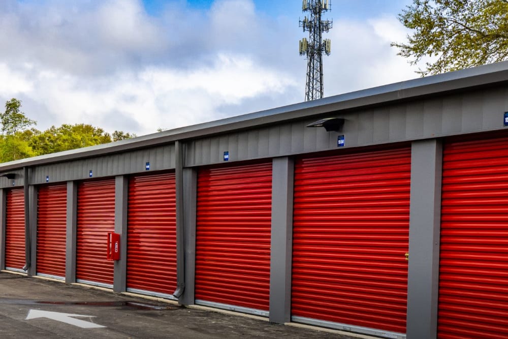 A row of drive-up storage units at Avid Storage in Pace, Florida