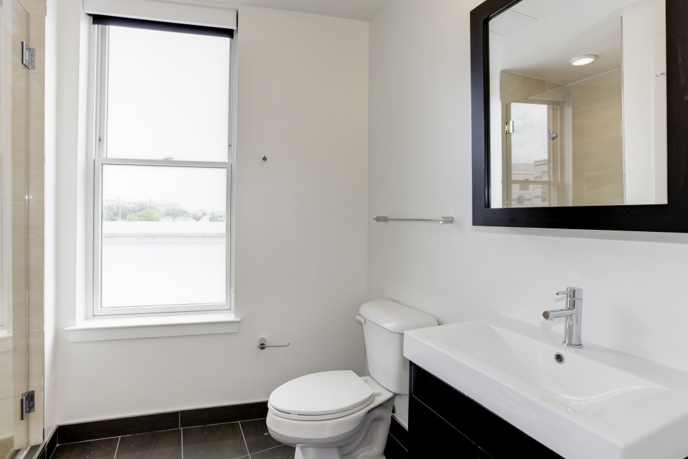 Bathroom with wood style flooring and a shower at 1350 Florida in Washington, District of Columbia