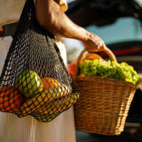 Resident buying fruits at a supermarket near Palisades at Paris Mountain in Greenville, South Carolina