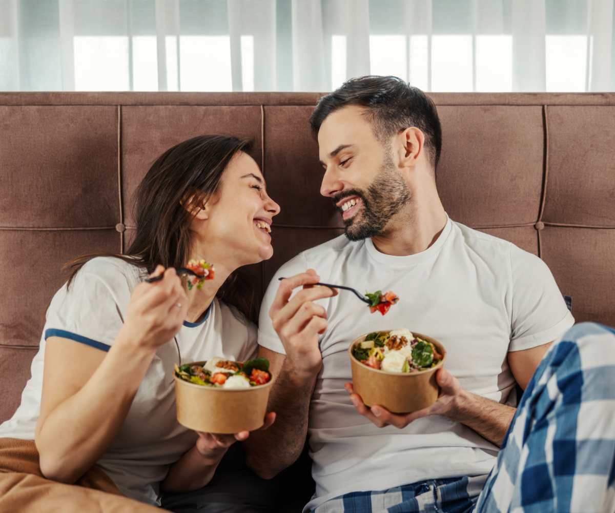 Resident couple having food together at Midtown Exchange Apartments in Minneapolis, Minnesota