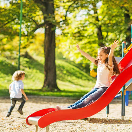 Kids playing in playground near 353 Main Street Family Apartments in Redwood City, California