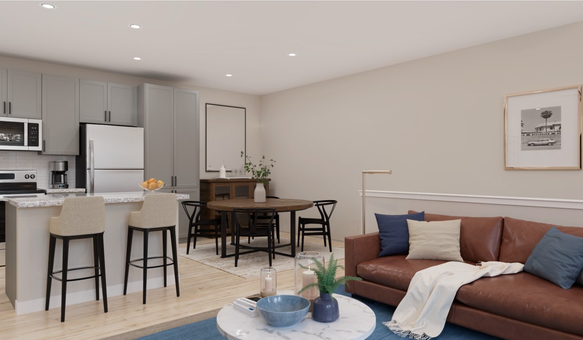 Hepburn floor plan living room and kitchen with grey cabinets at Remington Lake Apartments in Hamilton, Ohio