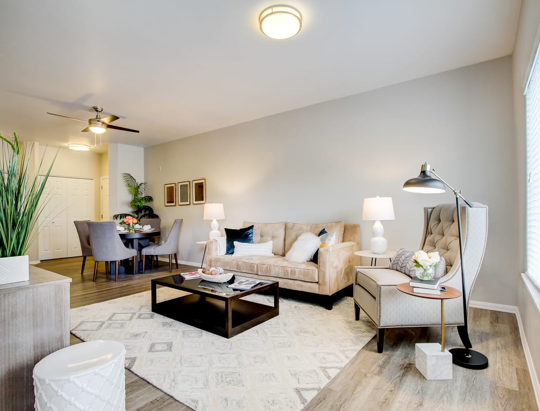 Bright and spacious open-concept living space in model home at River Trail Apartments in Puyallup, Washington