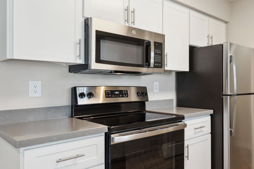 Renovated kitchen with Quartz Countertops  The Reserve at Capital Center Apartment Homes in Rancho Cordova, California