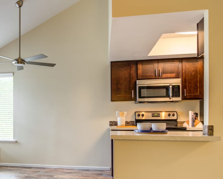 Ample natural light in a model home's kitchen and dining areas at Sofi Lake Oswego in Lake Oswego, Oregon