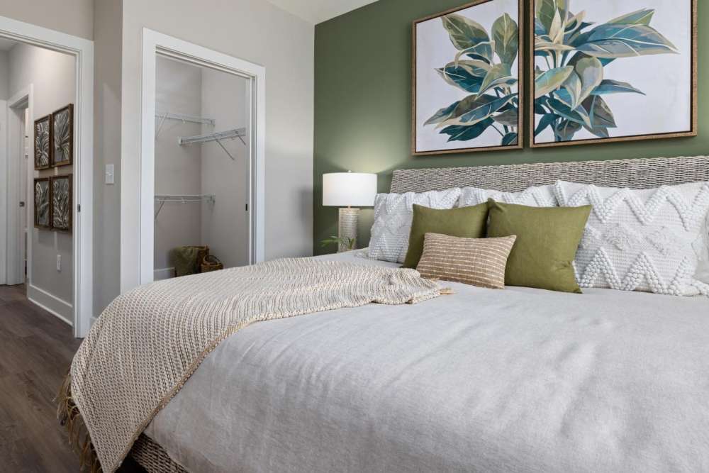 Well-lit master bedroom with own bathroom and walk-in closet at Hudson Carolina Forest in Myrtle Beach, South Carolina