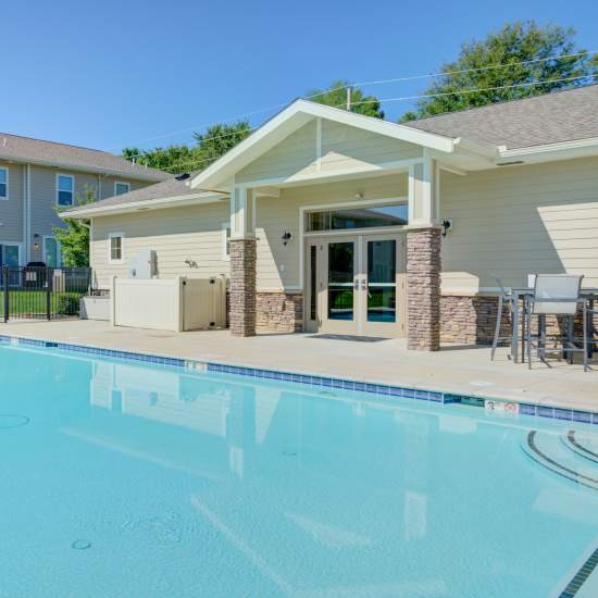 A resort style swimming pool with sparkling clean water at Chapel Ridge in Lees Summit, Missouri