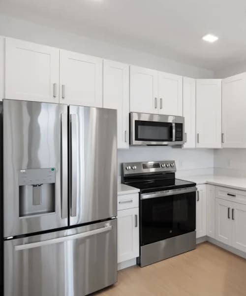 Cozy kitchen stainless steel appliances at The Waterfront on Hatchett Creek in Venice, Florida
