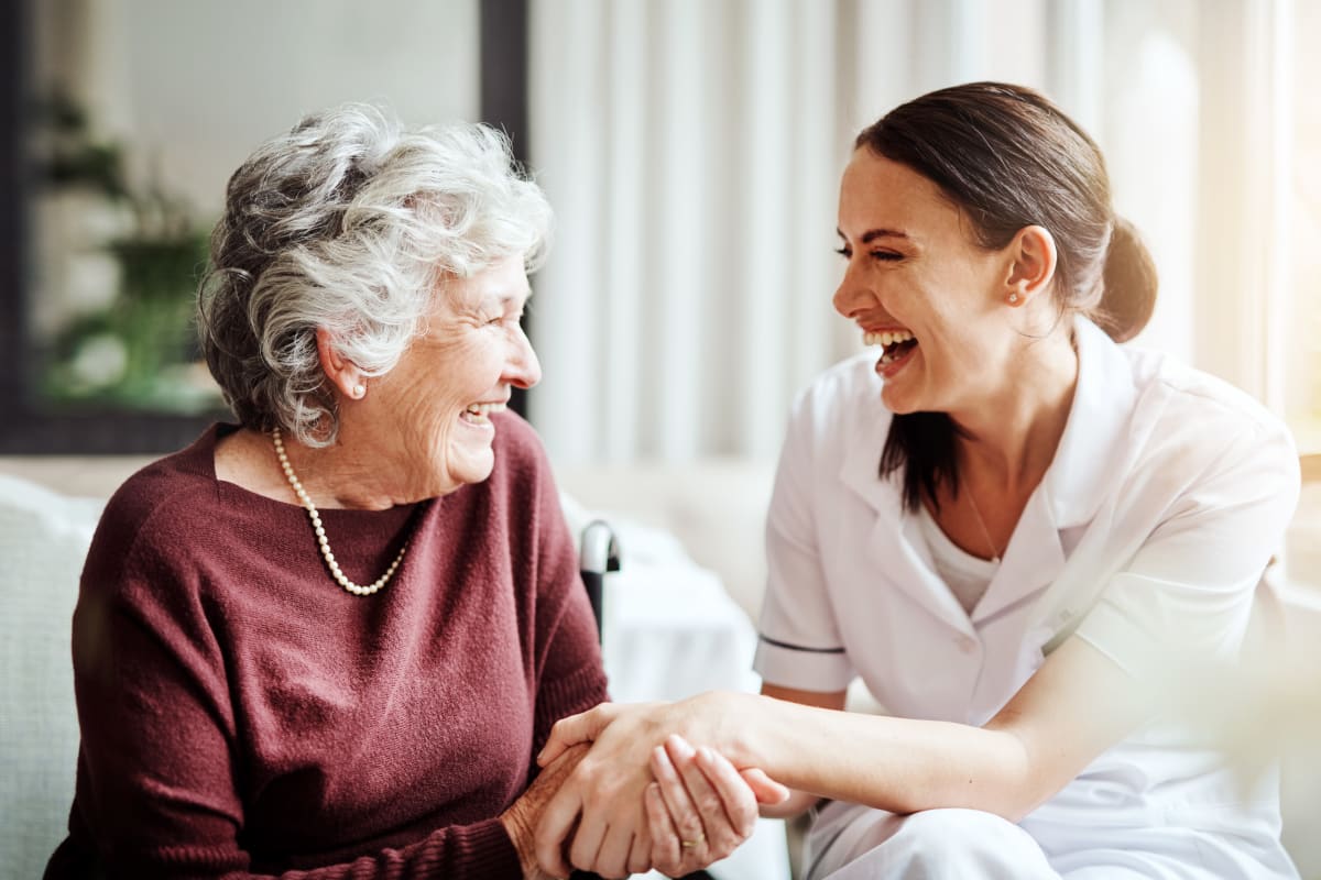 Caretaker talking to a resident at Gentry Park Orlando in Orlando, Florida