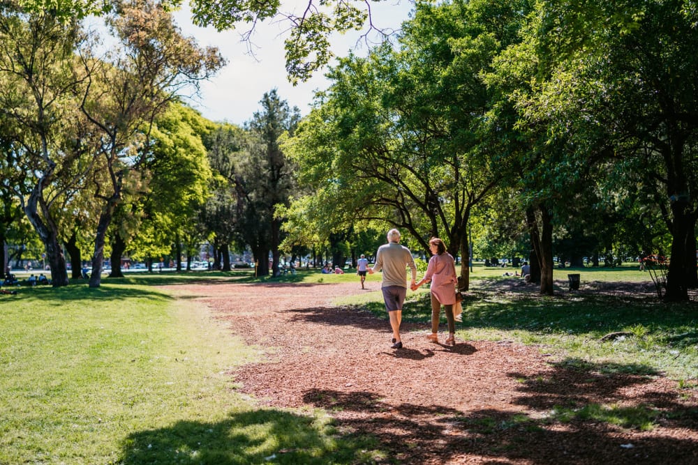 Residents going for a walk at a local park at Mariposa at Westchester in Grand Prairie, Texas