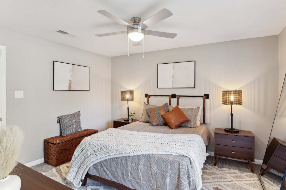 Renovated bedroom with ceiling fan at Atlas at Goodlett Farms in Cordova, Tennessee