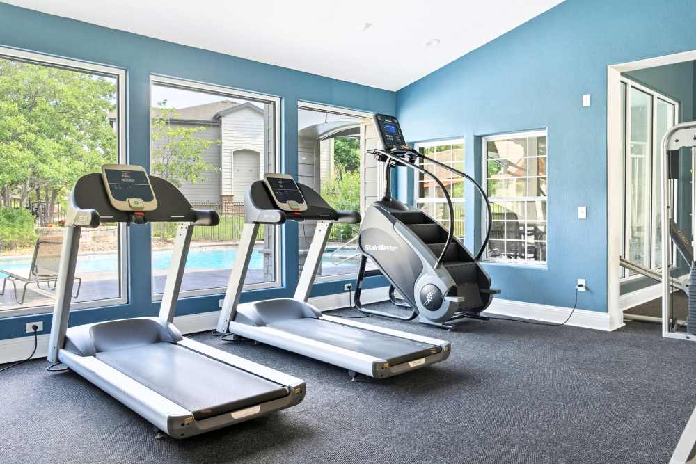 Gym with treadmill and stair stepper at The Highlands in Overland Park, Kansas