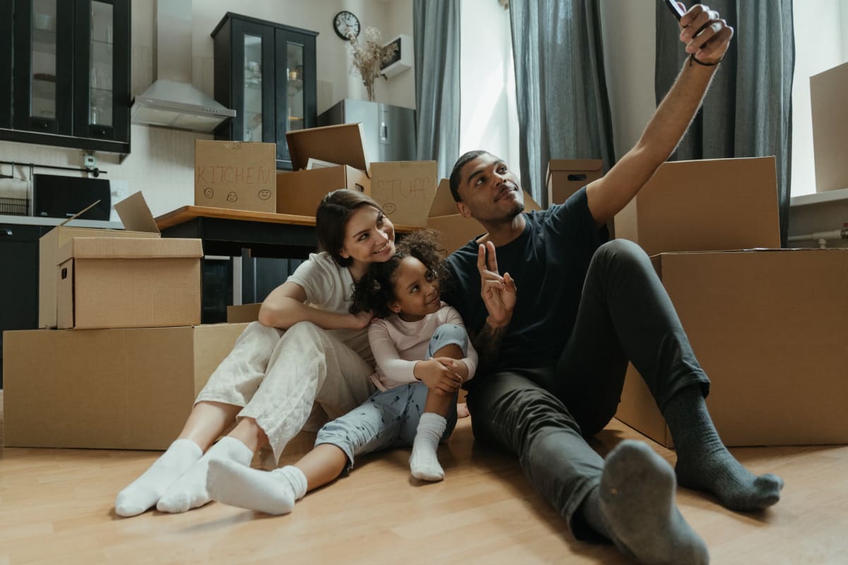Residents with boxes behind them in their apartment at El Paseo in Tustin, California