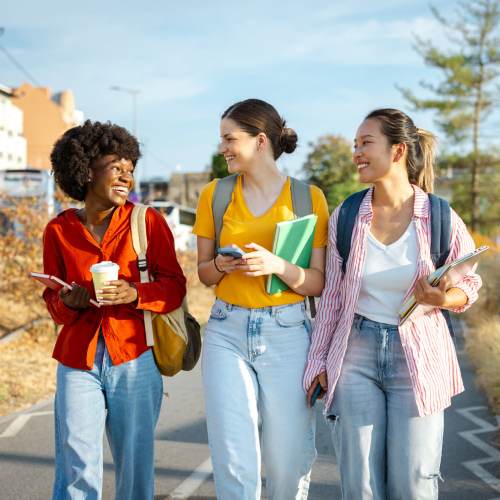 Friends out exploring the city on the weekend at Titan Court in Eugene, Oregon