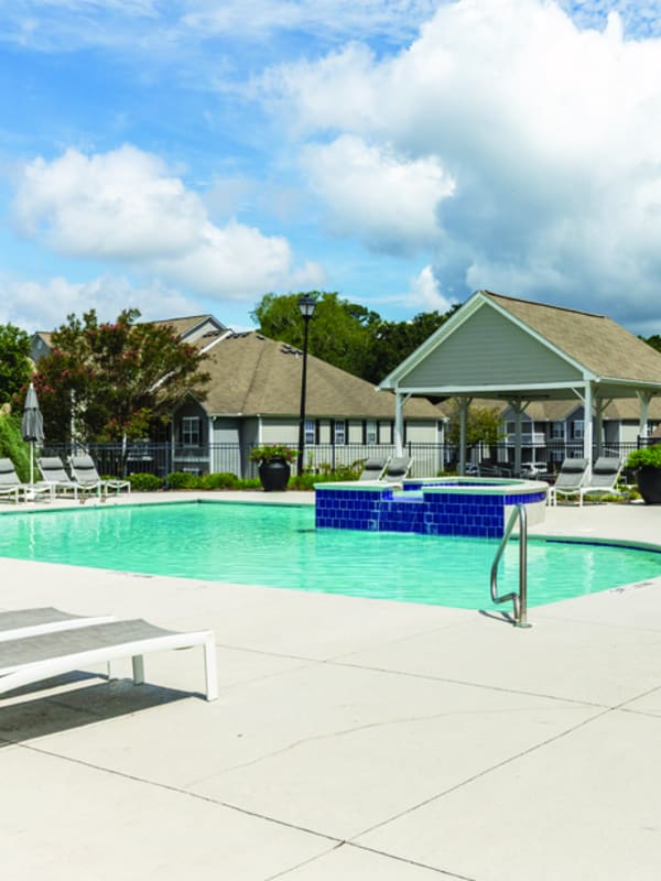 Swimming pool and patio with lounge chairs
