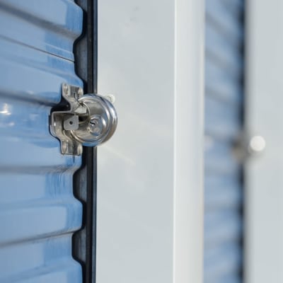 A lock on a blue storage unit door at Storage Star Domain in Austin, Texas