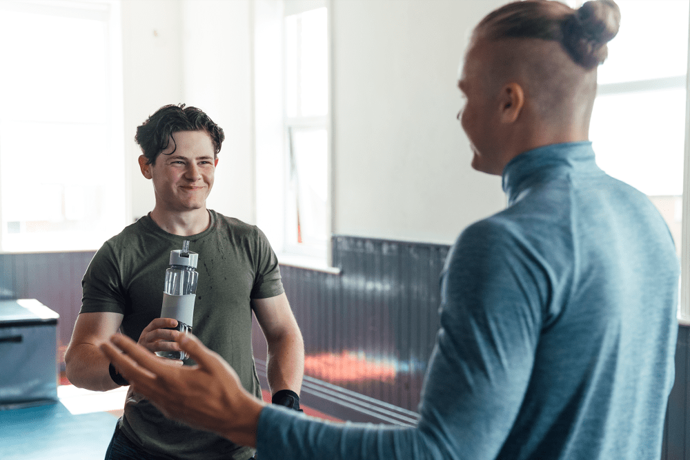 Residents catching up after a workout in the fitness center at Huntersville Apartment Homes in Huntersville, North Carolina