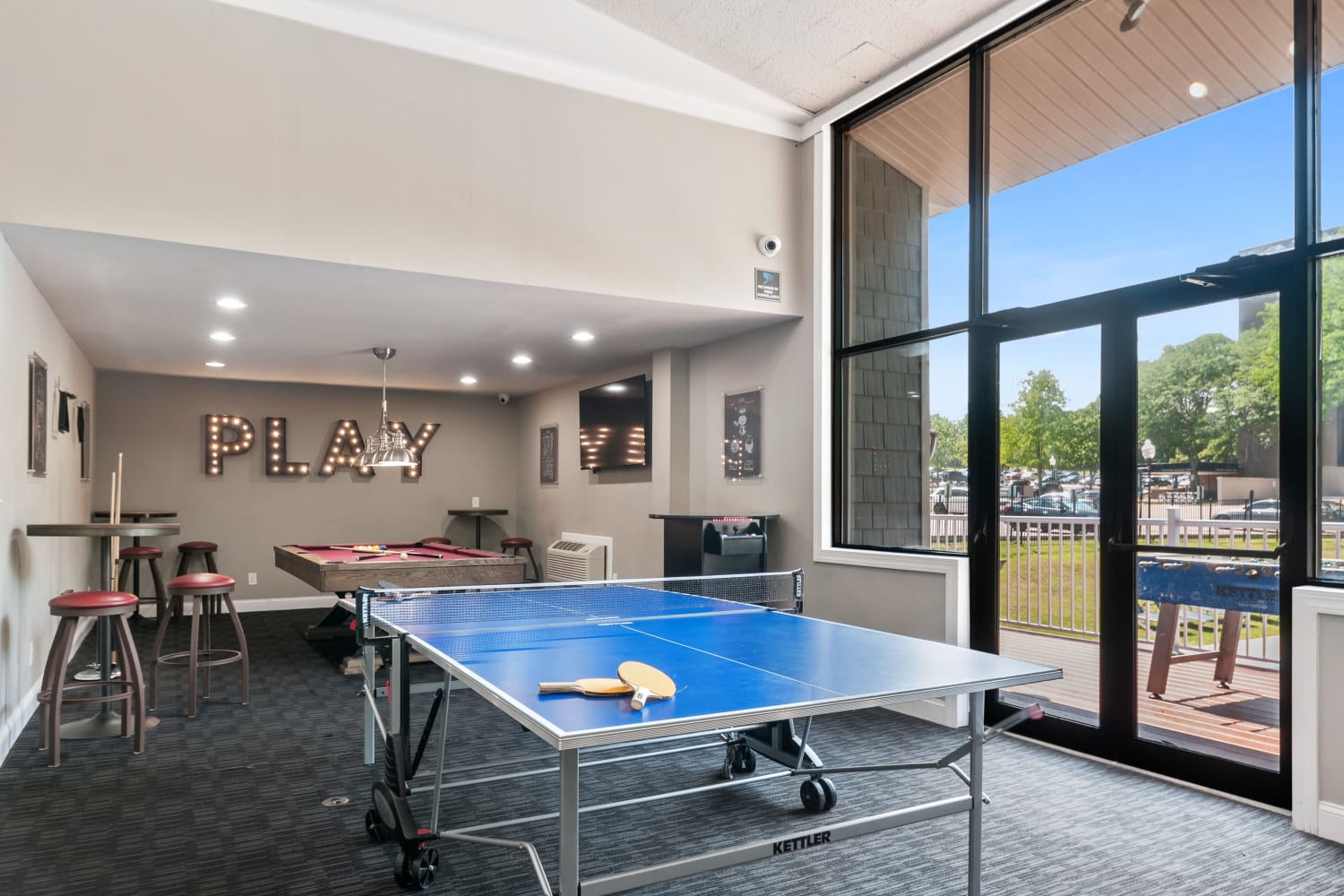 Resident clubhouse with a kitchen and billiards at Timberlake Apartment Homes in East Norriton, Pennsylvania