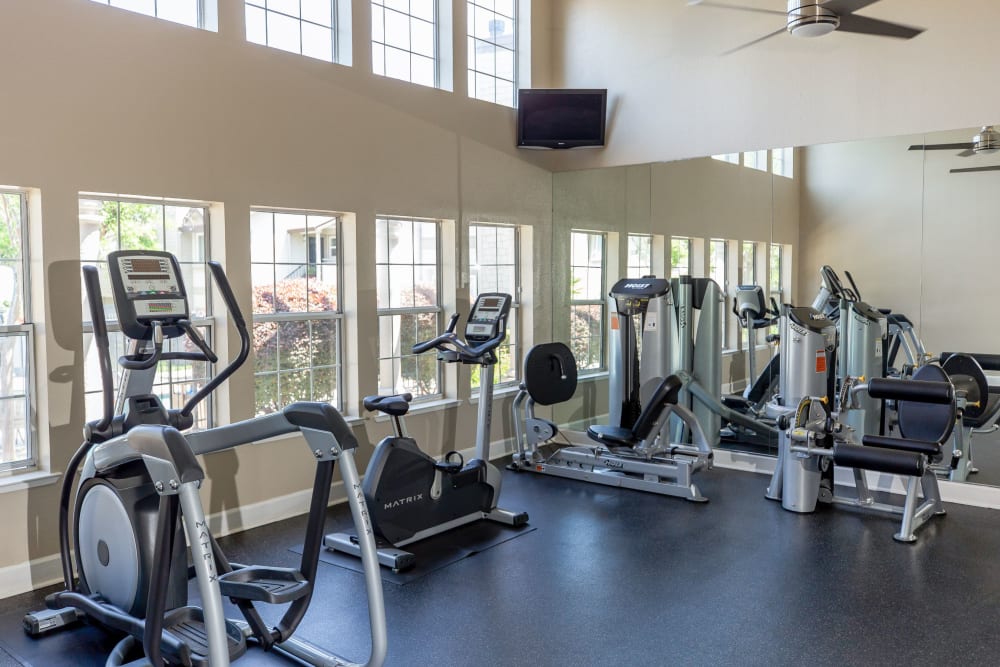 Spacious fitness center with a ceiling fan at Shaliko in Rocklin, California