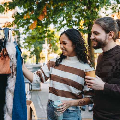 Residents shopping a sidewalk sale at 1801L Apartments in Sacramento, California