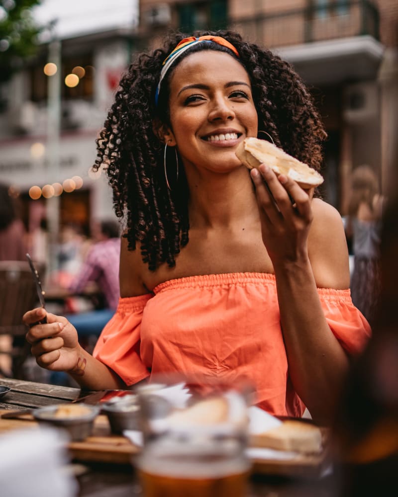 Resident eating at a restaurant near Villas de Santa Fe in San Antonio, Texas