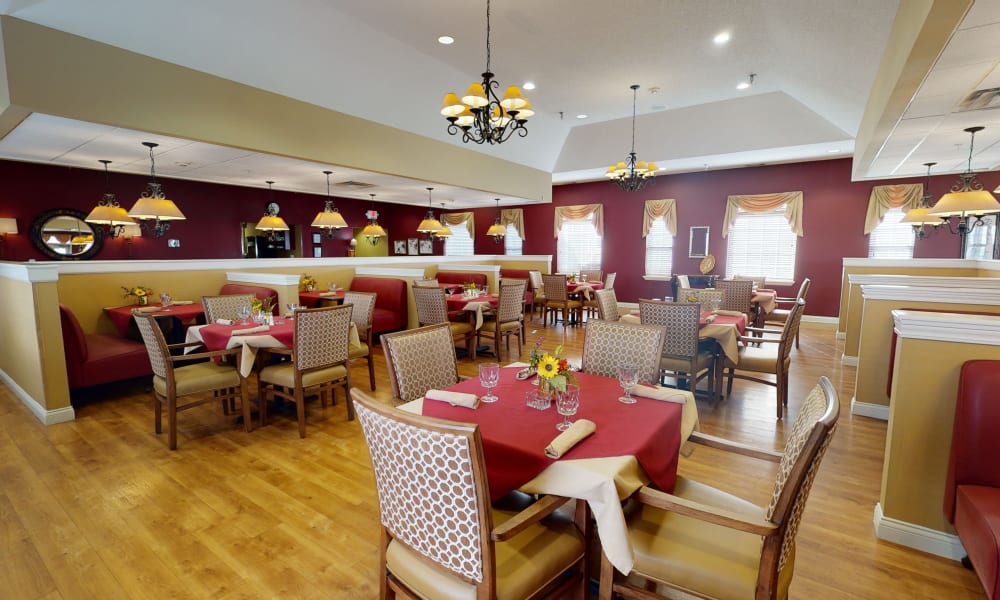 Dining room tables set for a meal at The Keystones of Cedar Rapids in Cedar Rapids, Iowa