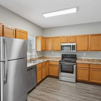 Model apartment with wood-style flooring at Orchard Hills, Jeffersonville, Indiana