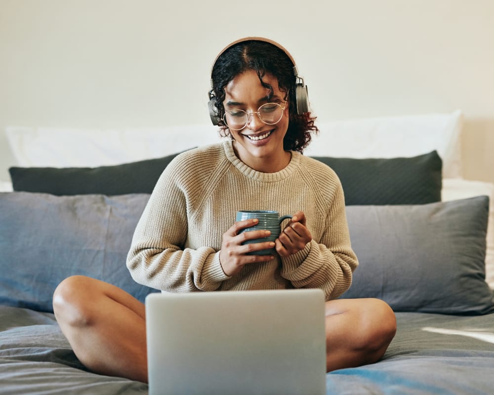 Resident in her bedroom on her computer at The Millton in Redwood City, California