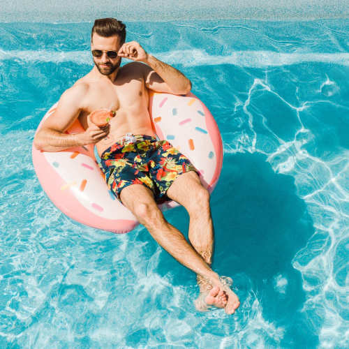Resident sitting in a pool at The Oliver in Charlotte, North Carolina
