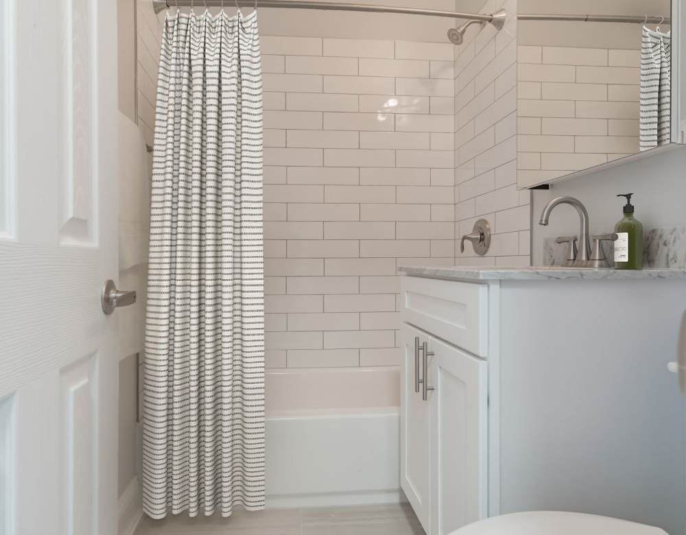 A modern bathroom at Bergen Apartments in Freeport, New York