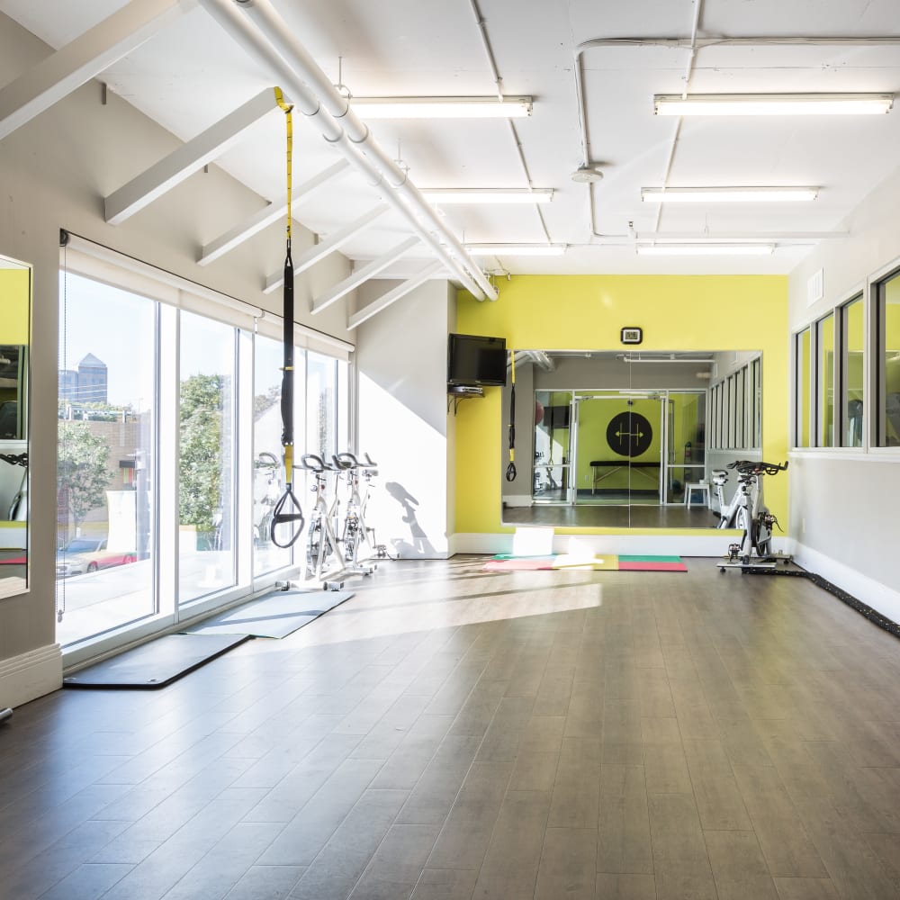 Spacious fitness center with plenty of individual workout stations at The Heights at Park Lane in Dallas, Texas