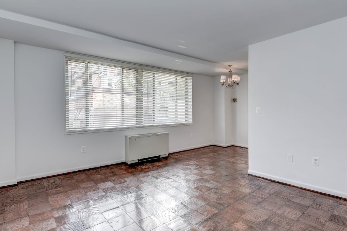 Empty floor plan with nice dark wood style flooring in the living area at Hill House in Washington, District of Columbia