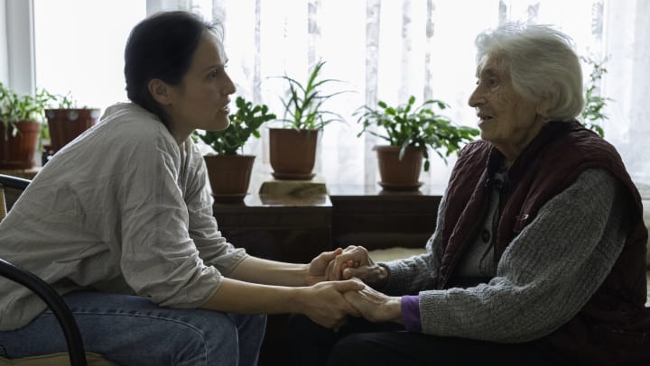Adult daughter talking to mom about assisted living options