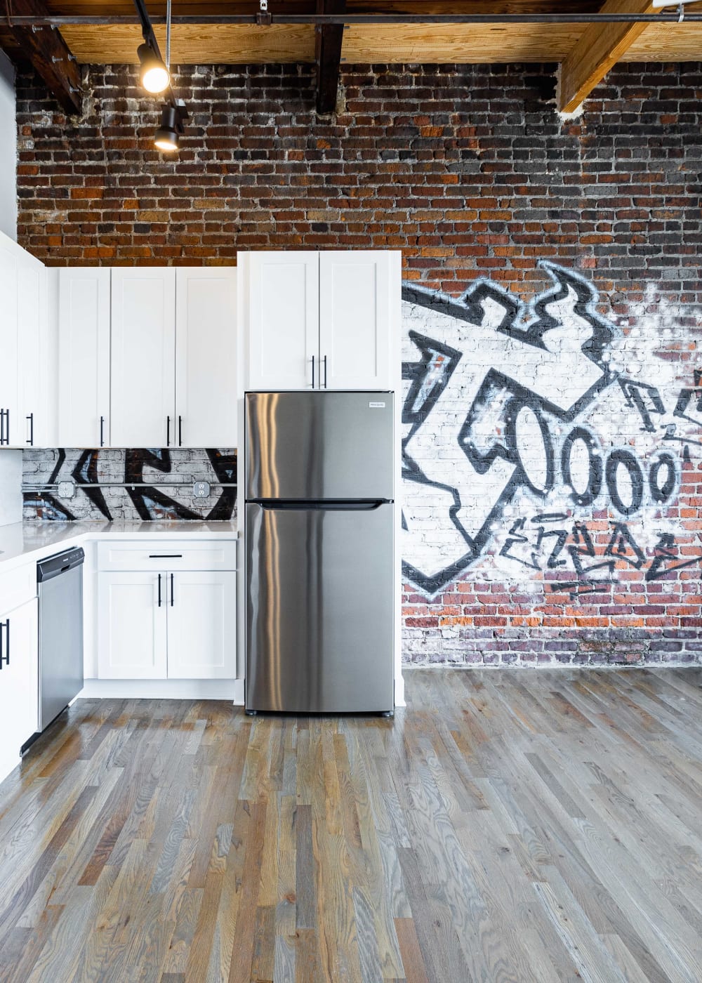 Kitchen with graffiti at Lofts at Abrams Fixtures in Atlanta, Georgia