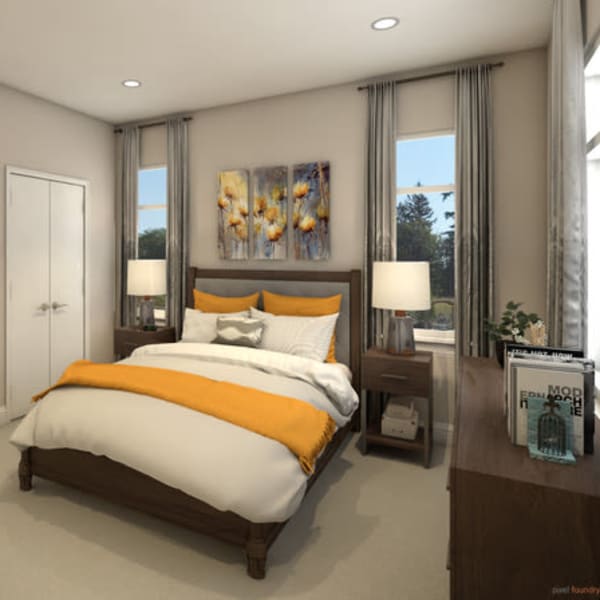 Furnished bedroom with a large bed inside a cottage at Quail Park at Browns Point in Tacoma, Washington
