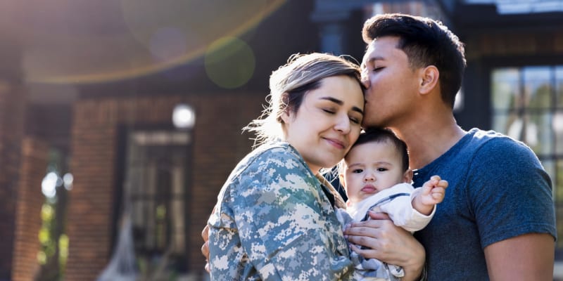 a family embrace near Santa Cruz in Point Mugu, California