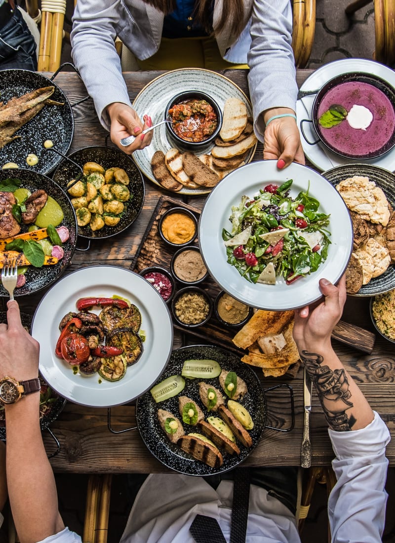 Friends eating together at Marquis at Cinco Ranch in Katy, Texas