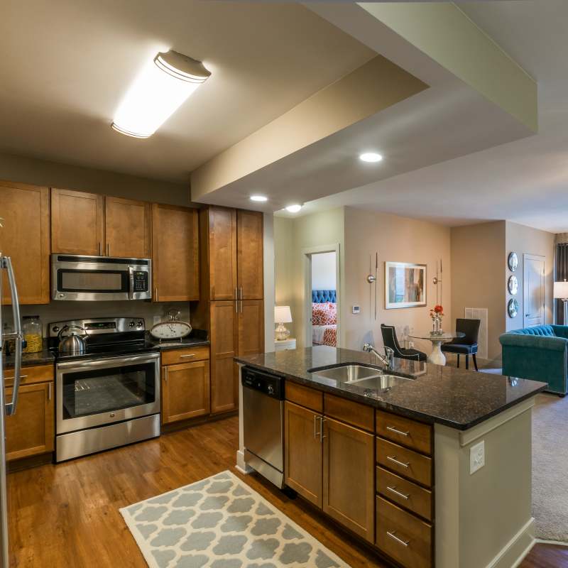 Modern kitchen with stainless-steel appliances at Attain at Quarterpath, Williamsburg, Virginia