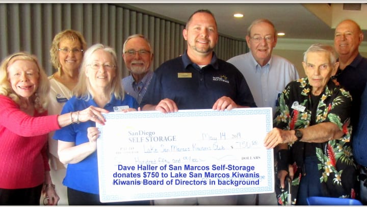San Marcos Mini Storage presenting a check to Lake San Marcos Kiwanis Club Foundation