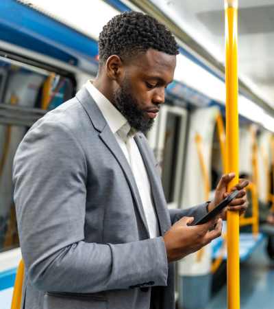 Resident checking online billls near Gateway Park Apartments in Denver, Colorado