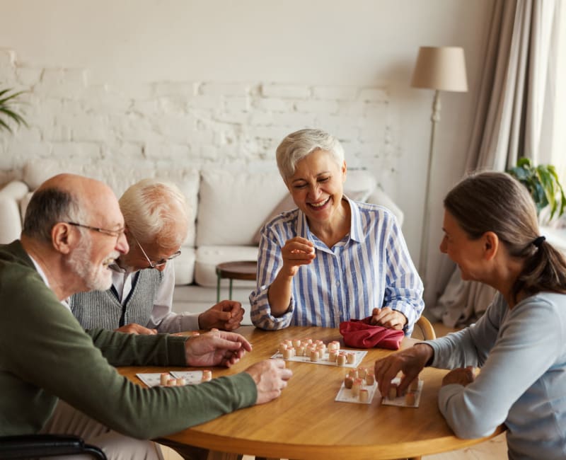 Residents playing a board game at Willows Bend Senior Living in Fridley, Minnesota