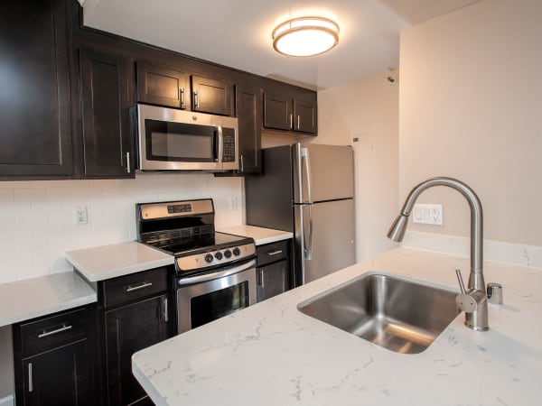 Modern kitchen with stainless-steel appliances at Tower 737 Condominium Rentals in San Francisco, California