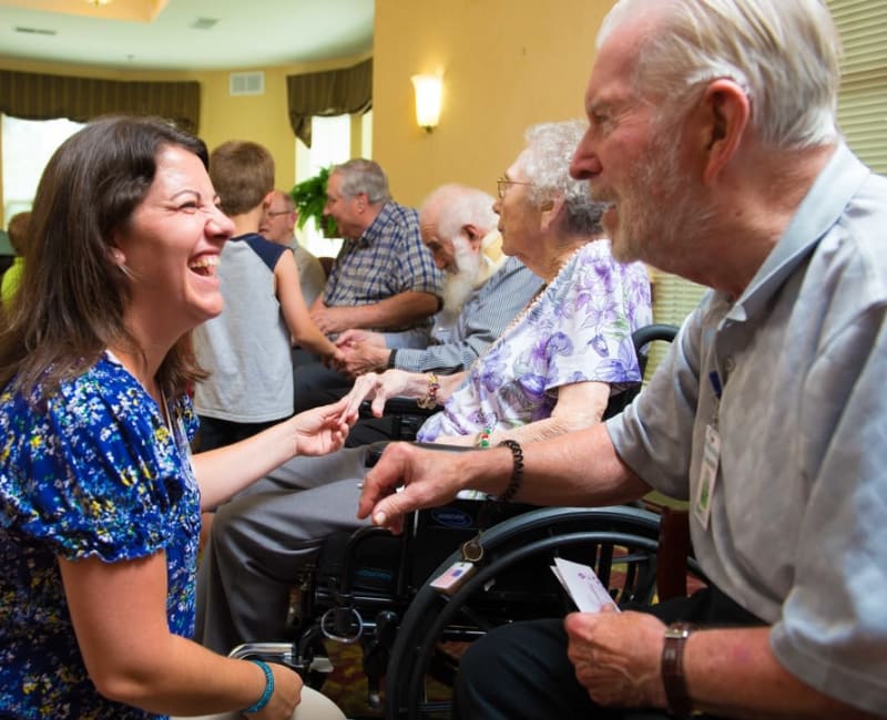 A staff member laughing with a resident at Ebenezer Ridges Campus in Burnsville, Minnesota. 