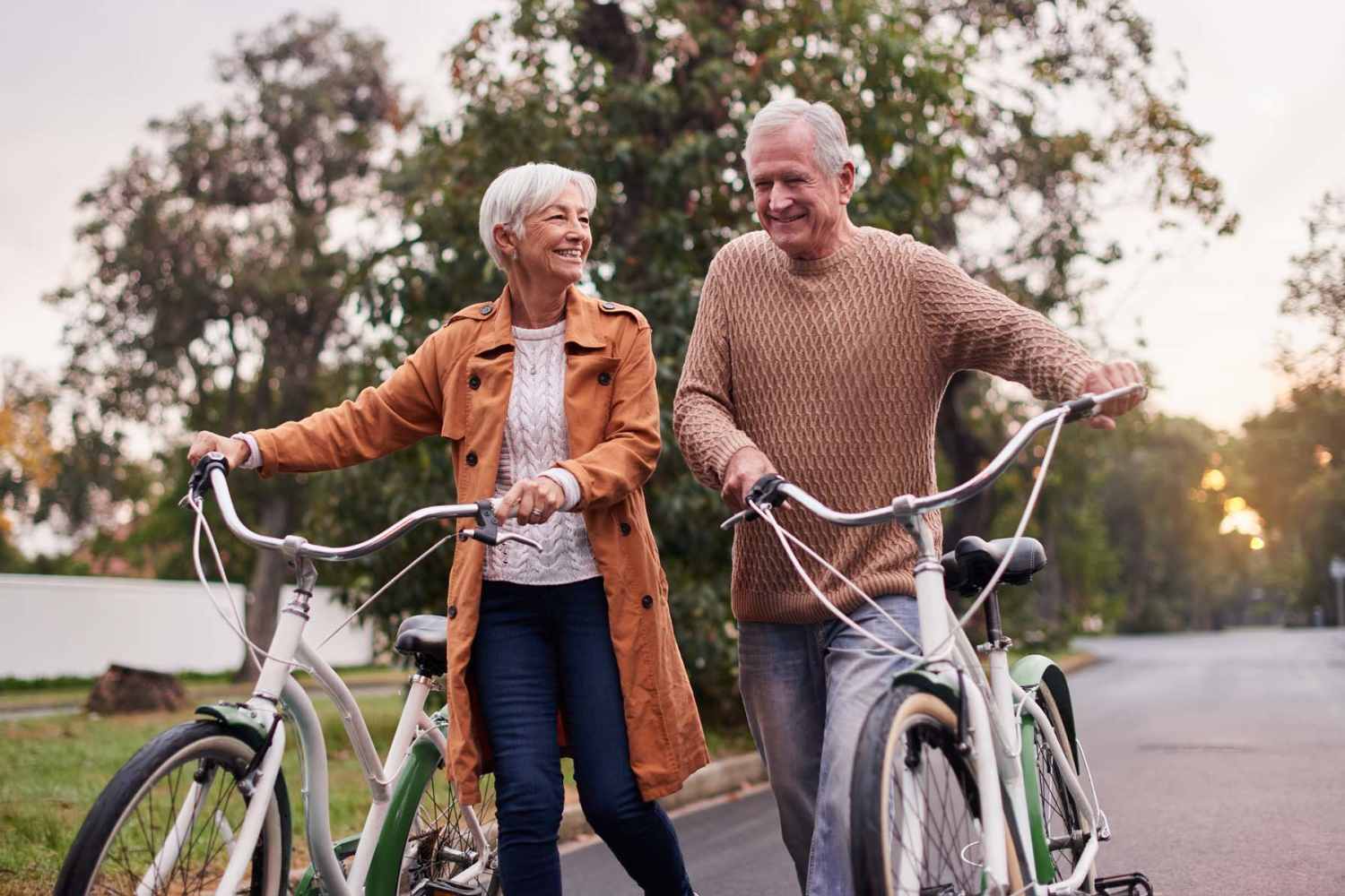 Residents walking bikes near Grande Oak Apartments in Williamsburg, Virginia