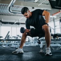 A man lifting weights at Heritage at Riverstone in Canton, Georgia