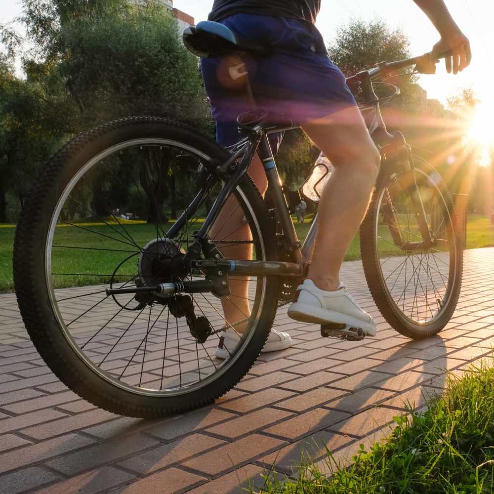 Resident riding bike at Oak Ridge Apartments in San Antonio, Texas