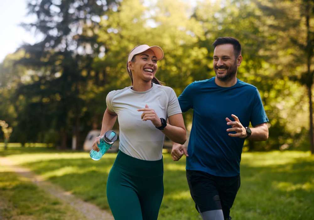 Couple going for a run in the park near Seapointe Villas in Costa Mesa, California